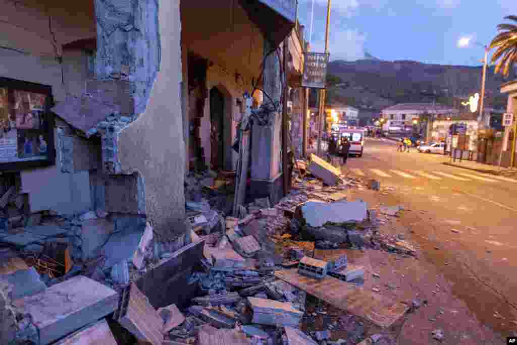 Debris of a partially collapsed house sit on the street in Fleri, Sicily Italy. A quake triggered by Mount Etna volcano has jolted eastern Sicily, slightly injuring 10 people and prompting frightened villagers to flee their homes.