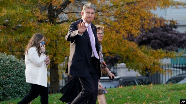 Sen. Joe Manchin, D-W.Va., walks on the White House campus, Nov. 18, 2021, in Washington.