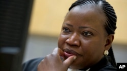 In this Nov. 27, 2013, file photo, prosecutor Fatou Bensouda waits for the start of the trial at the International Criminal Court (ICC) in The Hague, Netherlands. 