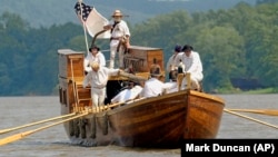 Meriwether Lewis was in charge of logistics on the Lewis and Clark expedition. So, he probably arranged for the boat and its supplies. In this photo, re-enactors of the boat crew of the Discovery Expedition retrace the steps of Lewis and Clark. (AP Photo/Mark Duncan)