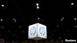 FILE - The Hewlett-Packard (HP) logo is seen as part of a display at the Microsoft Ignite technology conference in Chicago, Illinois, May 4, 2015.