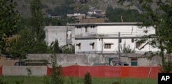 This May 2, 2011 file photo shows Osama bin Laden's compound in Abbottabad, Pakistan shortly after the raid that killed the al-Qaida leader.