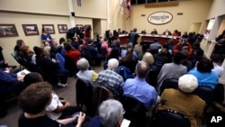 Ferguson residents pack the council chambers for a meeting of the City Council, Feb. 2, 2016, in Ferguson, Mo. 