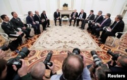 Russian President Vladimir Putin, Israeli Prime Minister Benjamin Netanyahu and other members of the delegations attend a meeting at the Kremlin in Moscow, Russia, Feb. 27, 2019.