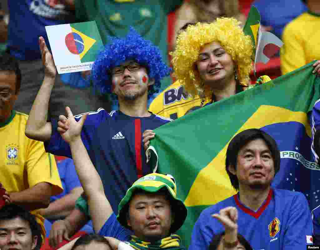 Fans cheer before the Confederations Cup Group A soccer match between Japan and Brazil at Estadio Nacional in Brasilia. 