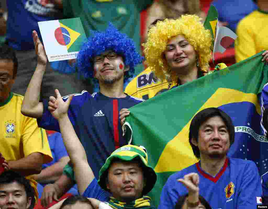 Fans cheer before the Confederations Cup Group A soccer match between Japan and Brazil at Estadio Nacional in Brasilia.