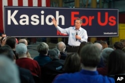 Republican presidential candidate, Ohio Gov. John Kasich speaks at a town hall meeting at Weldall Manufacturing in Waukesha, Wisconsin, March 29, 2016.