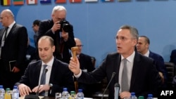 FILE - NATO Secretary General Jens Stoltenberg, right, and Georgia's Foreign Affairs Minister Mikheil Janelidze attend a NATO Foreign Affairs Ministers meeting at NATO headquarter in Brussels, Dec. 6, 2017. 