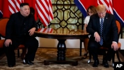 FILE - President Donald Trump meets North Korean leader Kim Jong Un in Hanoi., Feb. 28, 2019. 