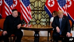 FILE - President Donald Trump meets North Korean leader Kim Jong Un in Hanoi., Feb. 28, 2019. 