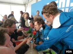 Men's downhill winner, Matthias Mayer of Austria, speaks to reporters at the dais after his news conference, Rosa Khutor Alpine Center, near Krasnaya Polyana, Russia, Feb. 9, 2014. (Parke Brewer/VOA).
