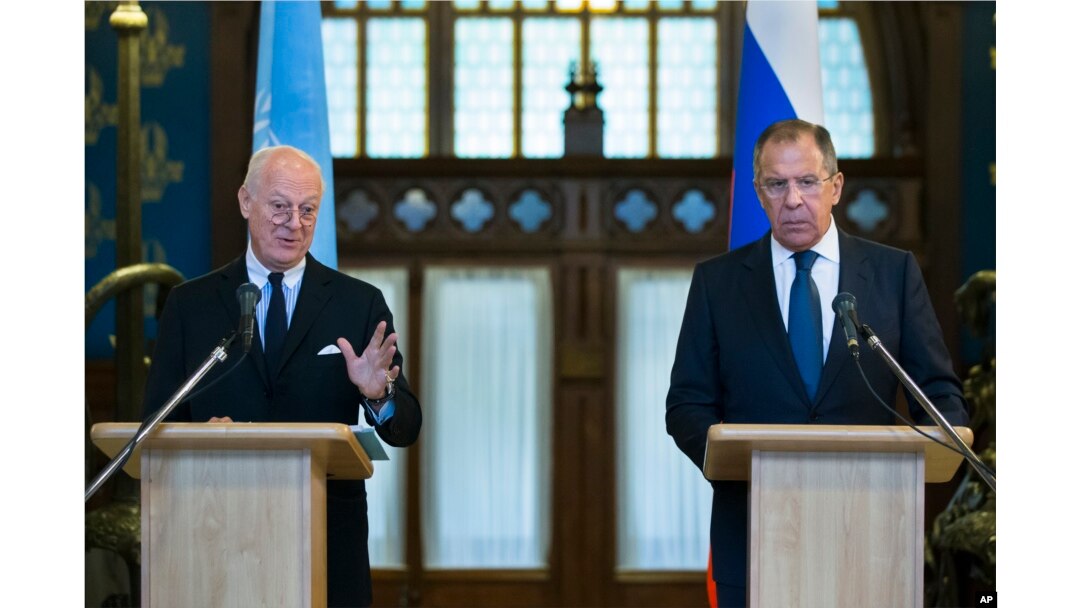 Russian Foreign Minister Sergey Lavrov, right, listens as U.N. Special Envoy for Syria Staffan de Mistura speaks during a news conference following their talks in Moscow, Russia, Nov. 4, 2015.