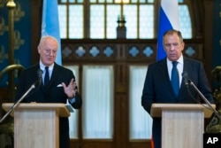 FILE - Russian Foreign Minister Sergey Lavrov, right, listens as U.N. Special Envoy for Syria Staffan de Mistura speaks during a news conference following their talks in Moscow, Russia, Nov. 4, 2015.