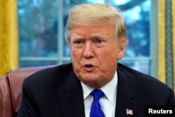 U.S. President Donald Trump sits for an exclusive interview with Reuters journalists in the Oval Office at the White House in Washington, Dec. 11, 2018.