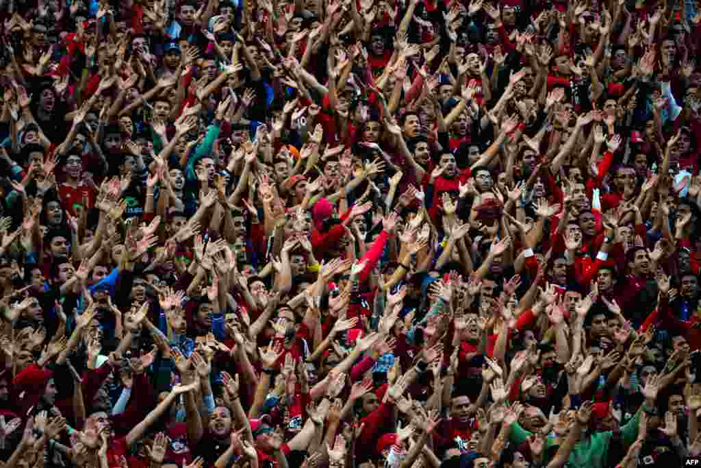 Egypt Al-Ahly fans chant slogans in support of their team ahead of the African Super Cup final football match against Tunisia&#39;s Club Sportif Sfaxien in Cairo.
