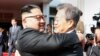 North Korean leader Kim Jong Un, left, and South Korean President Moon Jae-in embrace at a meeting May 26, 2018, north of the DMZ in this photo released by Moon's spokesperson. 