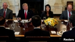 U.S. President Donald Trump, seated with Secretary of State Rex Tillerson, U.S. Ambassador to the United Nations Nikki Haley and U.S. National Security Adviser H.R. McMaster, at the White House in Washington, Jan. 29, 2018. 