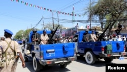 FILE: Policemen drive past in their truck as they take part in a parade to mark the 24th self-declared independence day for the breakaway Somaliland nation from Somalia in capital Hargeysa, May 18, 2015. 