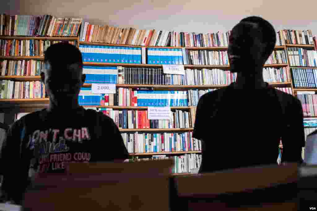Customers are seen at the Coimbra Bookshop in Bissau, one of the few places to buy books from local authors in the capital, in Bissau, Guinea-Bissau, Dec. 19, 2017. (R. Shyrock/VOA)
