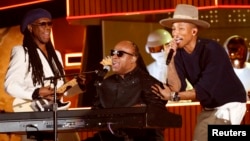 FILE - Stevie Wonder (C) performs the Daft Punk's song "Get Lucky" with Pharrell Williams and Nile Rodgers (L) at the 56th annual Grammy Awards in Los Angeles, Jan. 26, 2014