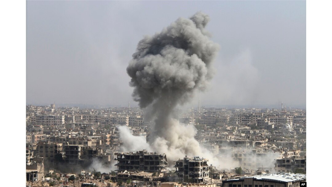 Smoke rises after shelling by the Syrian army, after Russian airstrikes, in Damascus, Syria, Oct. 14, 2015.