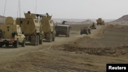FILE - Egyptian Army vehicles are seen in the troubled northern part of the Sinai Peninsula during a launch of a major assault against militants, in al- Arish, Egypt, in this undated handout picture made available by the Ministry of Defense, March 4, 2018.