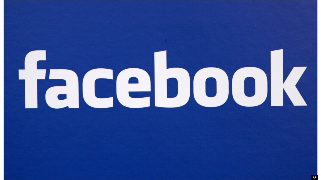 FILE - Facebook logo is displayed at a Facebook announcement in New York.