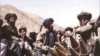 FILE - Taliban fighters near Kabul.