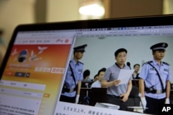 A photo described as the trial showing human rights lawyer Xie Yang which is seen on the social media of the Changshai Intermediate People's Court is displayed on a computer in Beijing, May 8, 2017.