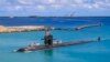 FILE - Attack submarine USS Oklahoma City returns to the U.S. Naval Base in Guam, Aug. 19, 2021. The U.S. sharing nuclear submarine technology with Australia, along with China’s naval expansionism in the South China Sea, have left Indonesia with a delicate balancing act.