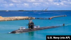 FILE - Attack submarine USS Oklahoma City returns to the U.S. Naval Base in Guam, Aug. 19, 2021. The U.S. sharing nuclear submarine technology with Australia, along with China’s naval expansionism in the South China Sea, have left Indonesia with a delicate balancing act.