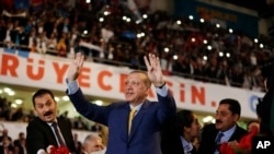 Turkey's President Recep Tayyip Erdogan waves to supporters as he arrives for a congress of the ruling Justice and Development Party (AKP) in Ankara, Turkey, May 21, 2017.