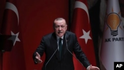 FILE - Turkish President Recep Tayyip Erdogan speaks at a meeting of his party in Ankara, Dec. 6, 2018.