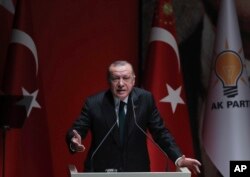 FILE - Turkish President and ruling Justice and Development (AK) Party chair Recep Tayyip Erdogan speaks at a meeting of his party in Ankara, Dec. 6, 2018. “No one can lecture our country about democracy, human rights, and freedom,” Erdogan said a recent event.