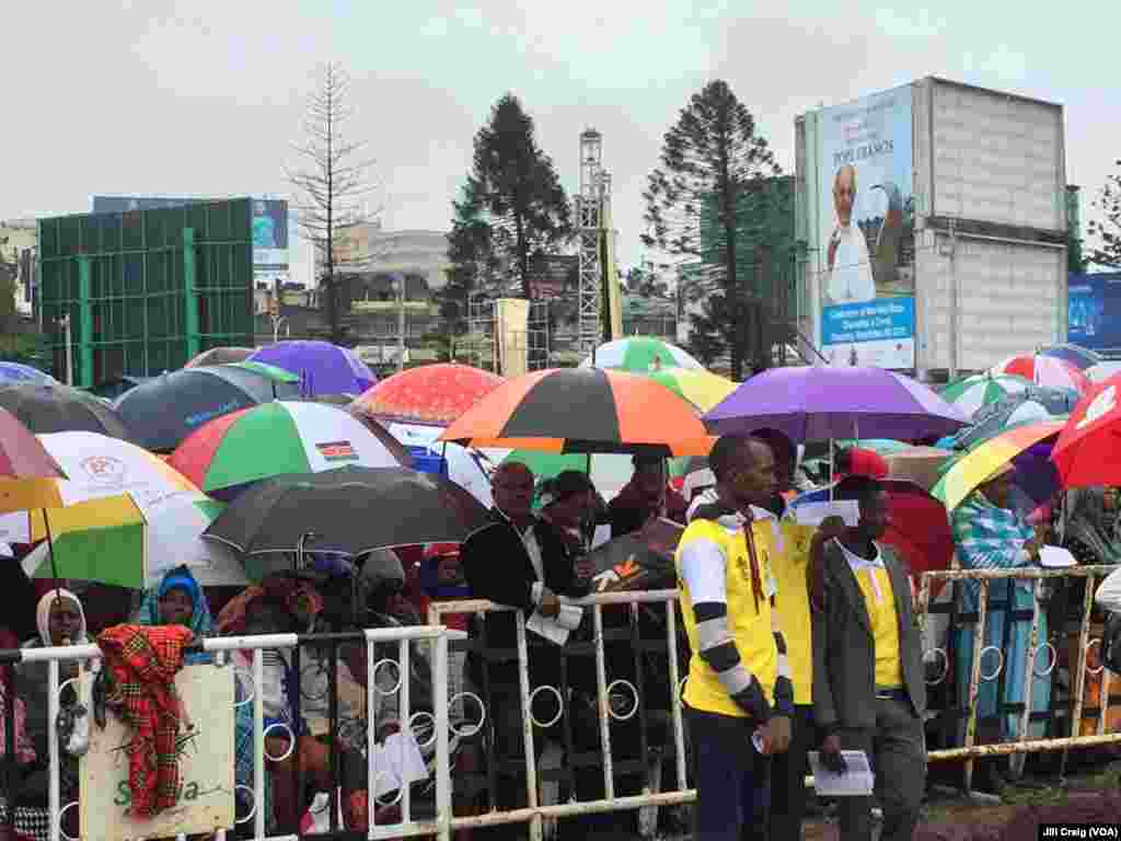The faithful attend a Mass by Pope Francis, as rain falls at the campus of the University of Nairobi, in Kenya, Nov. 26, 2015. Francis is on a six-day pilgrimage that will also take him to Uganda and the Central African Republic. 