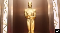 FILE - An Oscar statue is on display in Los Angeles, March 2, 2104. 