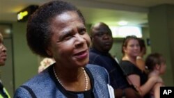 Former South African anti-apartheid activist Mamphela Ramphele speaks to reporters at the East London airport in Eastern Cape, South Africa, after arriving to attend the late former South African President Nelson Mandela's funeral, Saturday, December 14. 