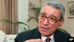 FILE - Former United Nations Secretary-General Boutros Boutros-Ghali gestures during an interview with the Associated Press in New York, May 21, 1997.