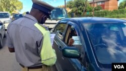 Police enforcing COVID-19 regulations. (VOA)