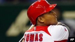 FILE - Cuban Yasmany Tomas is seen hitting a run home run.