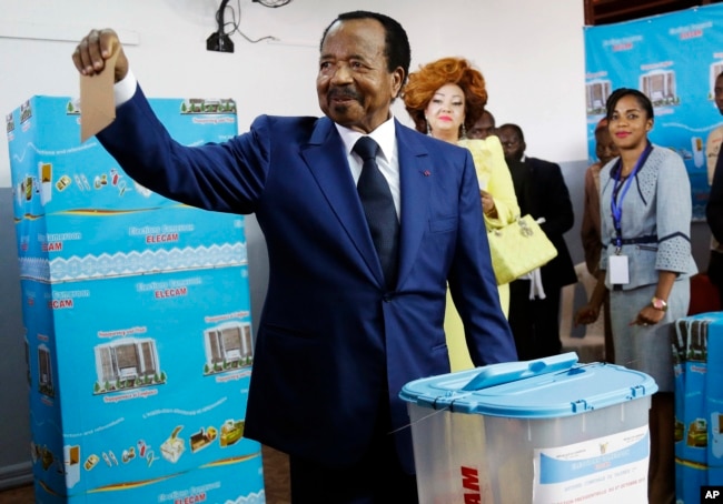 FILE - Incumbent President Paul Biya of the Cameroon People's Democratic Movement party, casts his vote during presidential elections in Yaounde, Oct. 7, 2018.