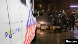 Police officers stand guard following Dutch Prime Minister Mark Rutte's announcement of new measures to fight a record surge in coronavirus disease (COVID-19) infections, in The Hague, Netherlands, Nov. 26, 2021.