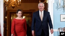 FILE - Secretary of State Rex Tillerson walks with Canadian Foreign Minister Chrystia Freeland at the State Department in Washington, Oct. 11, 2017. 