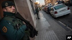 FILE - Spanish Civil Guard stand near a tea shop center (r) where they detained an unidentified man of Morocco, northern Spain, Dec.1, 2015. Statements from the interior ministries of both countries said three people were arrested in Spain's North African enclave of Ceuta while a Moroccan was arrested in the nearby Moroccan city of Ferkhana.