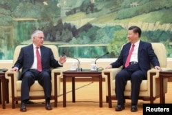 Chinese President Xi Jinping (R) shakes hands with U.S. Secretary of State Rex Tillerson before their meeting at at the Great Hall of the People on March 19, 2017 in Beijing, China.