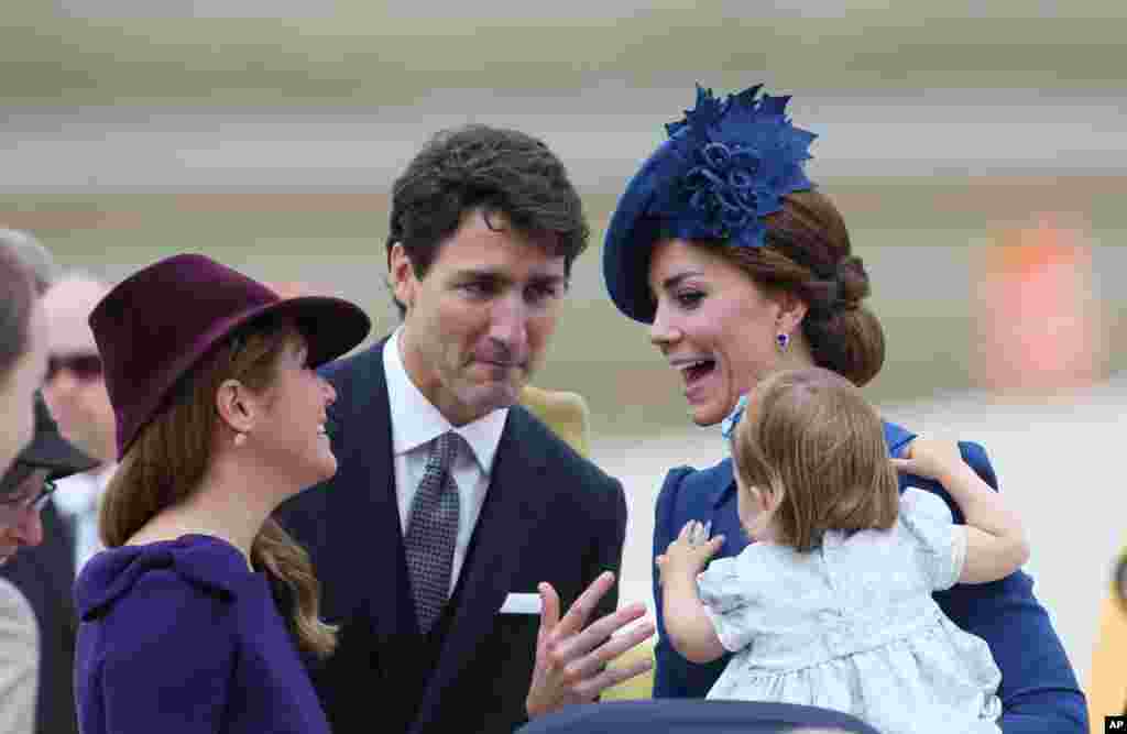 The Duchess of Cambridge and her daughter Princess Charlotte are greeted by Canadian Prime Minister Justin Trudeau and his wife Sophie Gregoire Trudeau at the Victoria International Airport in Victoria, British Columbia, Canada, Sept. 24, 2016.