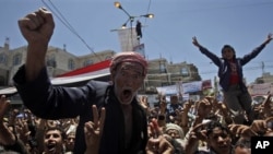 An anti-government protester reacts during a demonstration demanding the resignation of Yemeni President Ali Abdullah Saleh in Sana'a, Yemen, April 20, 2011