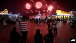 North Koreans gathered at Kim Il Sung Square to watch as fireworks explode in central Pyongyang, North Korea, July 27, 2014. 