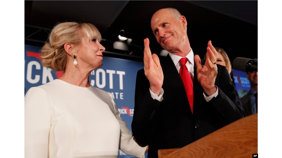 Republican Senate candidate Rick Scott thanks his wife Ann as he speaks to supporters at an election watch party, Nov. 7, 2018, in Naples, Florida.