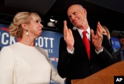 Republican Senate candidate Rick Scott thanks his wife Ann as he speaks to supporters at an election watch party, Nov. 7, 2018, in Naples, Florida.